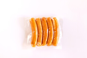Chicken sausage in vacuum package isolated on white background. - obrazy, fototapety, plakaty