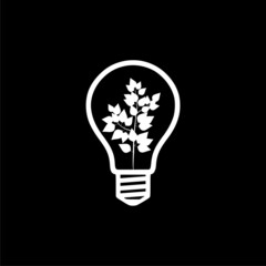 Light bulb with leaf icon isolated on dark background