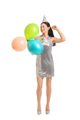 Fototapeta premium Beautiful woman with balloons on white background