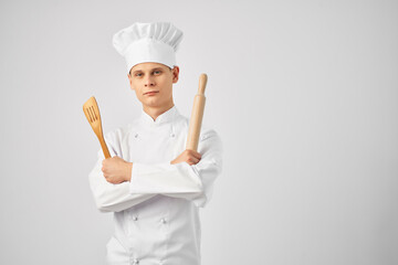 male chef cooking utensils in the hands of cooking