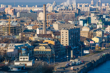 Kiev bussines and industry city landscape on river Dniper, bringe, and buildings