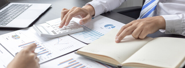 Brainstorm team, Marketers and financial accountants are discussing and analyzing charts to plan strategies to meet customer needs, Business data graph, Team meetings or business consulting.