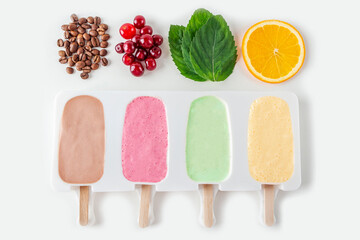 Step by step recipe. Cooking Homemade multicolored ice cream. Step5 cooked mix of cherry, mint, orange, cofee and coconut milk into molds. Natural fruit and berry popsicle sugar free.