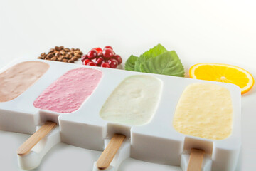 Step by step recipe. Cooking Homemade multicolored ice cream. Step5 cooked mix of cherry, mint, orange, cofee and coconut milk into molds. Natural fruit and berry popsicle sugar free.