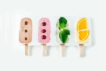 Step by step recipe. Cooking Homemade multicolored ice cream. Step6 decorate ice cream mix in molds with berries and fruits. Natural fruit and berry popsicle sugar free.