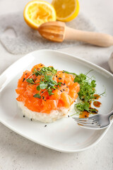 Delicious salmon tartar on light background, closeup
