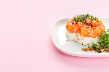 Delicious salmon tartar on color background