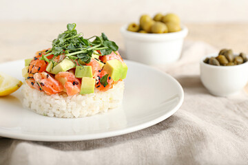 Delicious salmon tartar on grunge background