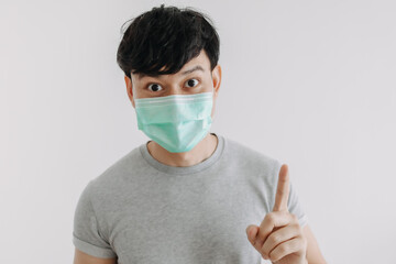 Close up of Happy Asian man wears mask isolated on white background.