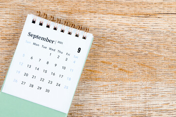 September Calendar 2021 on wooden table. - obrazy, fototapety, plakaty