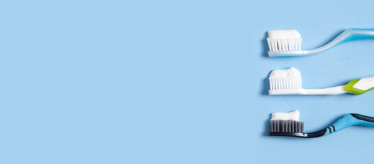 Toothbrushes on the blue background. Space for your text