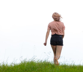 Girl in the rain on a dirt road