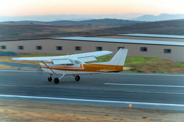 Airplane with a propeller taking flight in the airport