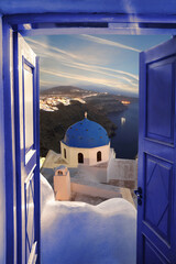 Santorini view with churches against blue door in Thira town, Greece