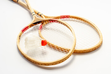 Competitive sports concept. Two badminton rackets and shuttlecock close up
