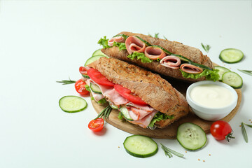 Concept of tasty eating with ciabatta sandwiches on white background