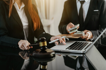 Lawyer businessman and two business partners giving bribe money in the envelope to partner in a corruption scam in office.