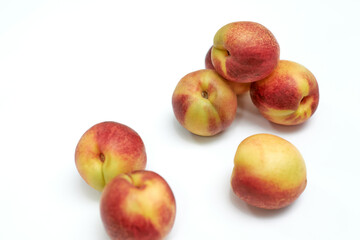 fresh ripe nectarines on white background