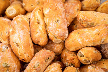 Freshly baked rustic Italian bread with green olives at the Sunday market