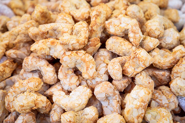Traditional Italian cookies made from almond flour (Amaretti) covered with powdered sugar
