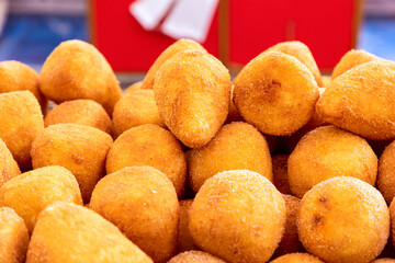 Sicilian arancini (Italian rice balls) Traditional street food in Italy.