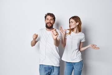 cheerful young couple in white t-shirts communication friendship emotions