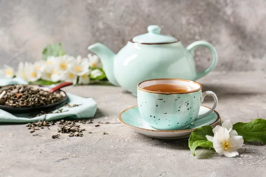 Composition With Cup Of Jasmine Tea, Dry Leaves And Flowers On Grunge  Background Stock Photo | Adobe Stock