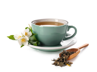 Cup of jasmine tea, flowers and scoop with dry leaves on white background