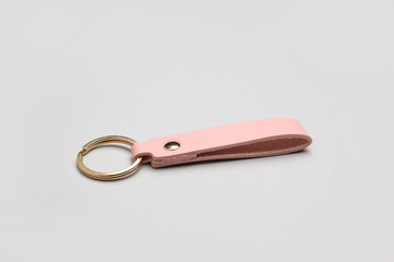 Leather keychain on grey background