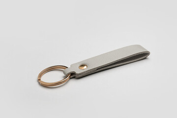 Leather keychain on grey background