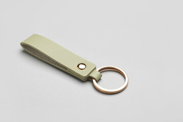 Leather keychain on grey background