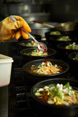 Add chilli powder to the cooking pot