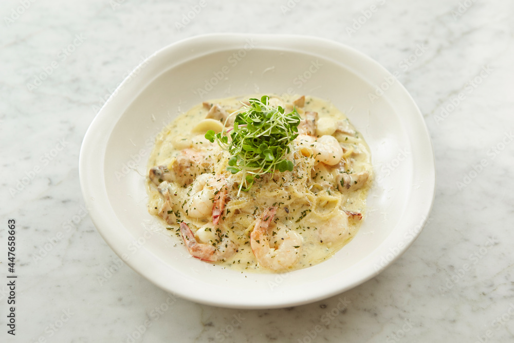 Poster Creamy seafood pasta on a plate 