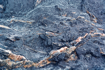 blue-violet stone texture with white and orange stripes, natural abstraction