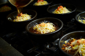 Add broth to boiling pot