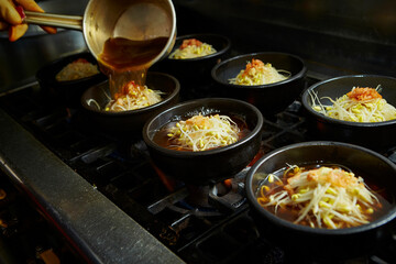 Add broth to boiling pot