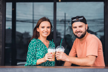 Beauty couple drinking coffee on cafe hipster style, beard man, woman in the dress, happy face, love romantic
