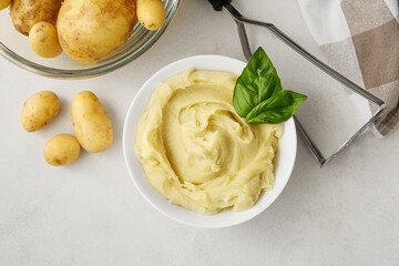 Composition with tasty mashed potatoes on light background