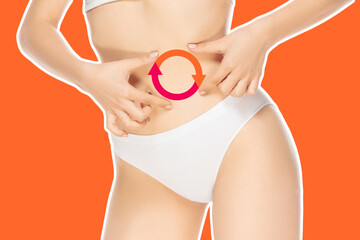 Female body, belly with drawing arrows. Fat lose, liposuction and cellulite removal concept. Good...
