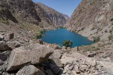 Landscape view of turquoise blue Gushor lake, third of the Marguzor seven lakes, Shing river...