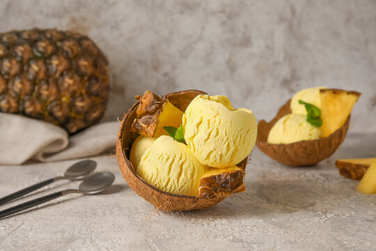 Tasty Pineapple Ice Cream In Coconut On Light Background