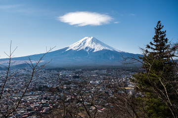 Solitary cumulus cloud with blue sky above Mt Fuji, Japan's Highest Mountain.