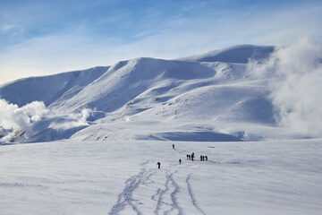 people hiking in the winter landscape of iceland