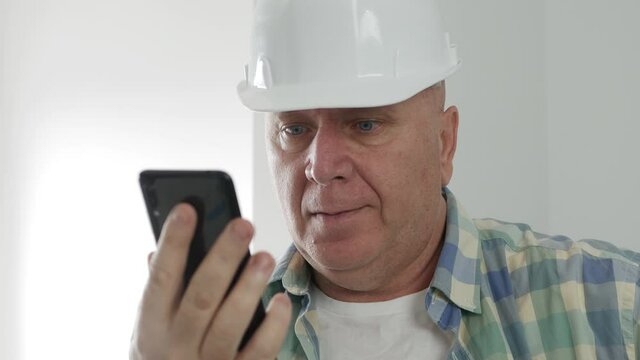 Engineer Text on Mobile Phone. Constructor Sending and Receiving Emails on Cellphone.