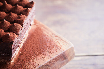 Slice of Tiramisu cake on table