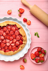 Composition with tasty strawberry pie on color wooden background