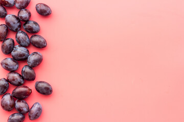 Purple cherry plums layout. Food fruits background. Top view