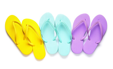 Set of stylish flip-flops on white background
