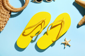 Stylish flip-flops on color background