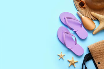 Set of beach accessories with flip-flops on color background